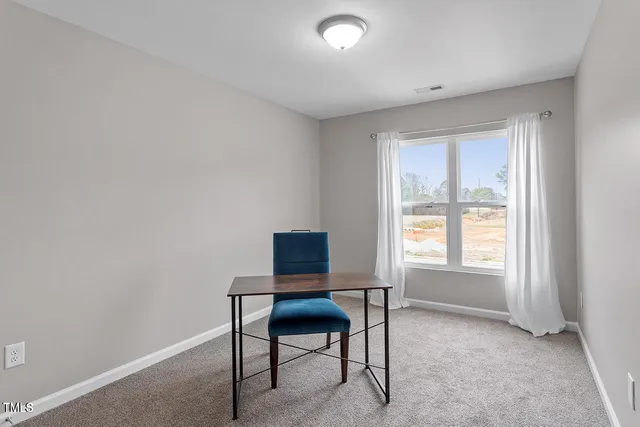 a workspace with furniture and a window