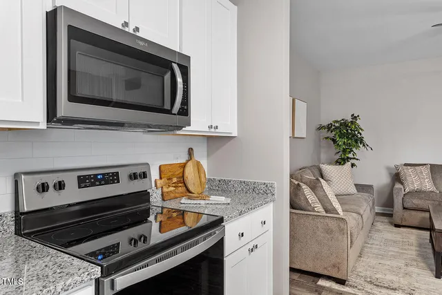 a kitchen with a stove and a microwave