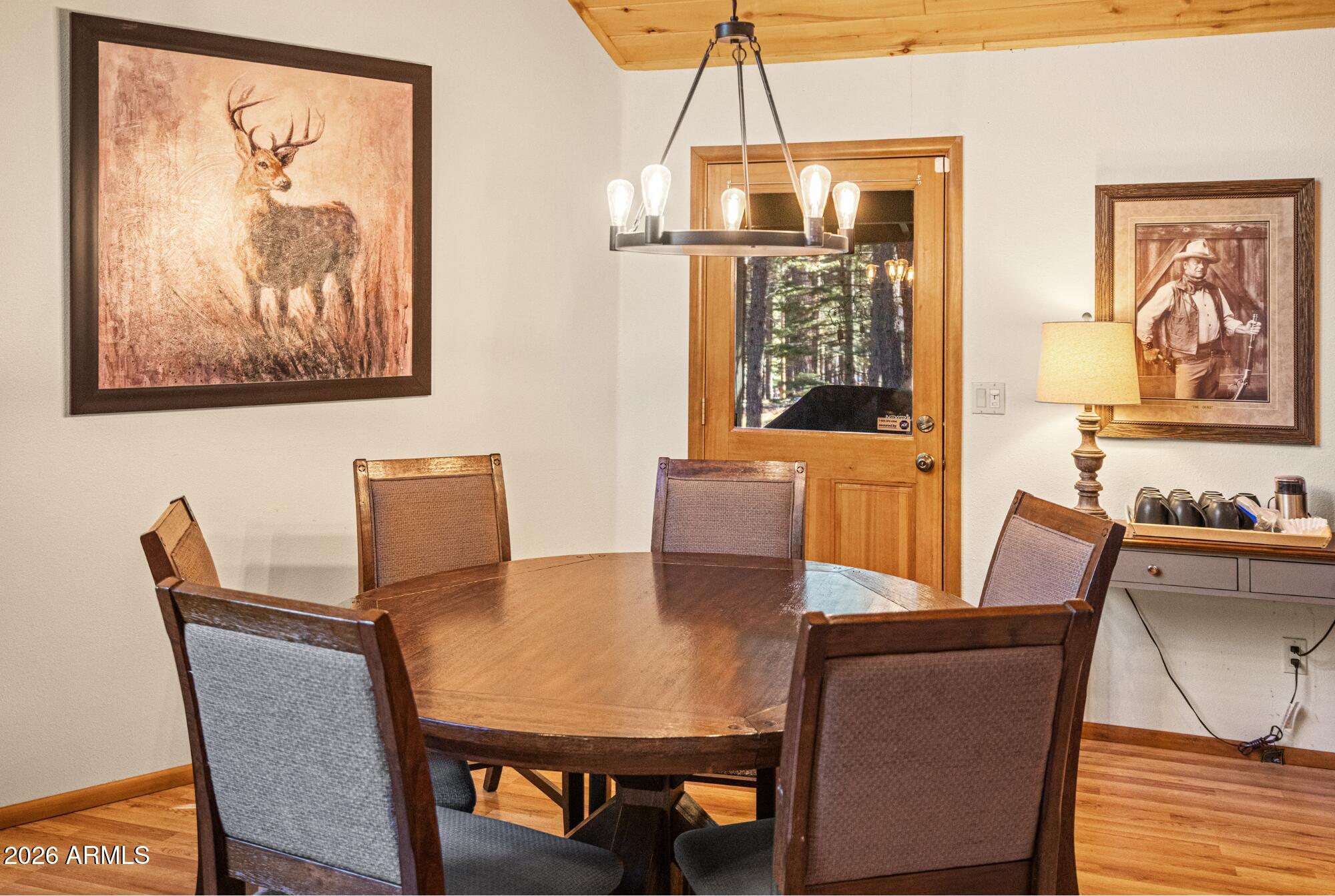628 Trout Springs Road Forest Lakes, AZ 85931 - Photo 12 of 49 a view of a dining room with furniture window and wooden floor