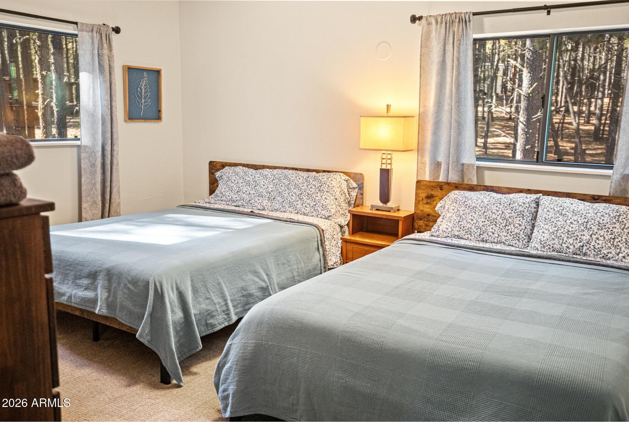 628 Trout Springs Road Forest Lakes, AZ 85931 - Photo 22 of 44 a bedroom with two beds and a window
