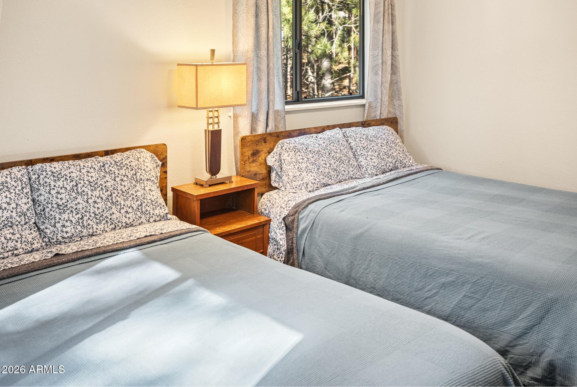 628 Trout Springs Road Forest Lakes, AZ 85931 - Photo 24 of 49 a bedroom with two beds and a window