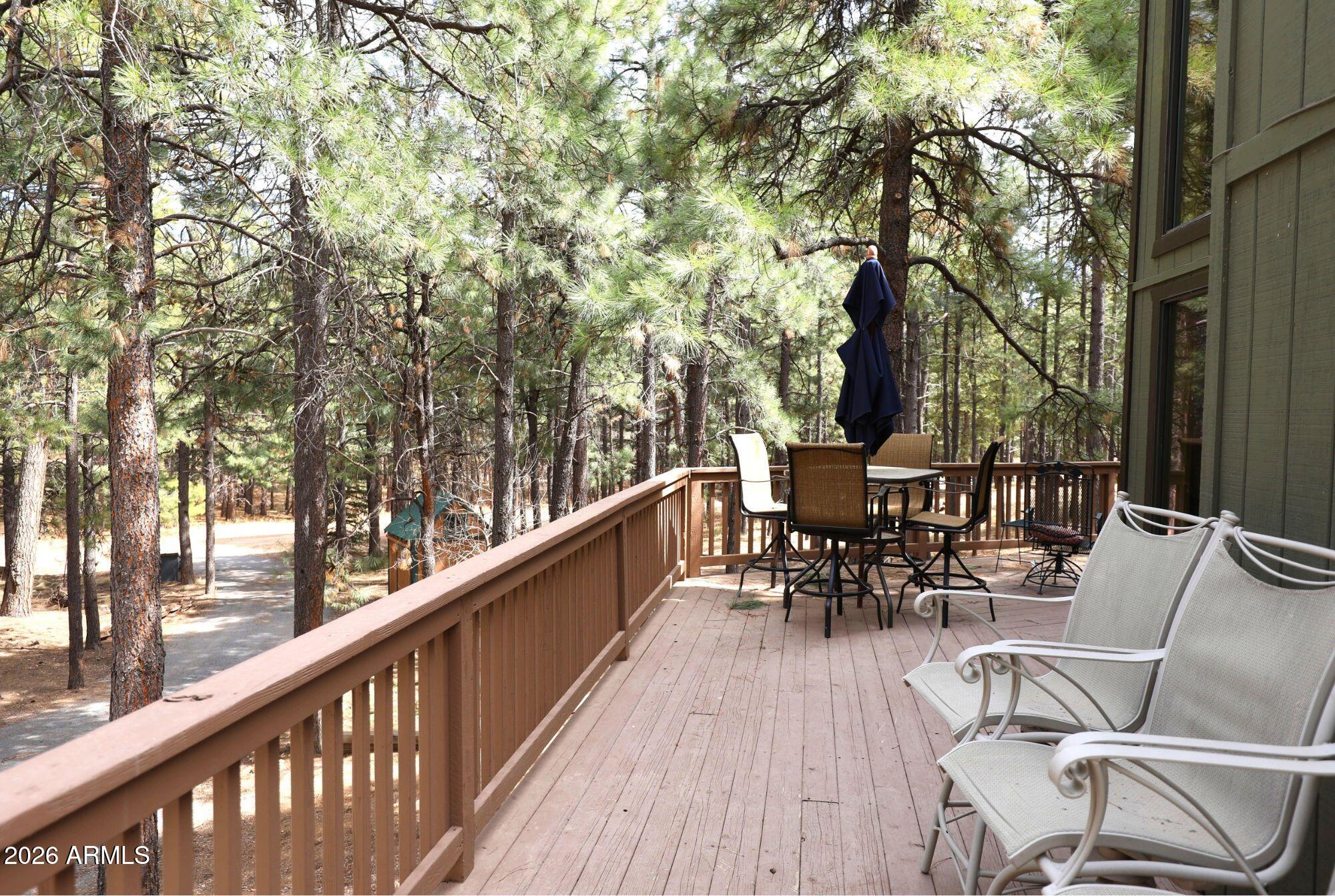628 Trout Springs Road Forest Lakes, AZ 85931 - Photo 3 of 49 a view of balcony with chairs and barbeque oven