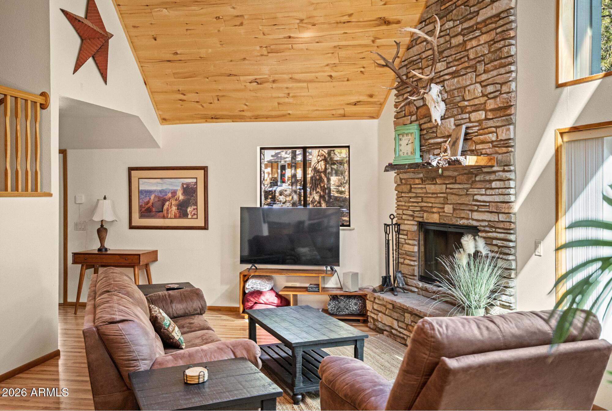 628 Trout Springs Road Forest Lakes, AZ 85931 - Photo 8 of 49 a living room with furniture or couch and a flat screen tv