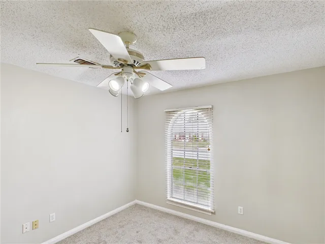 wooden floor in an empty room with a mirror