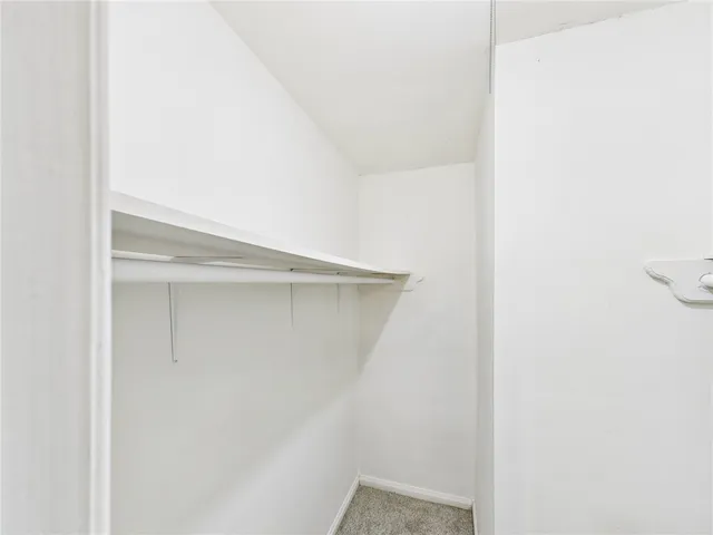a bathroom with a granite countertop toilet sink and shower