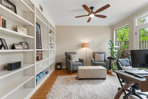 a living room with furniture and a rug