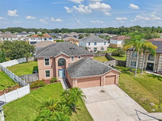 an aerial view of a house with a garden