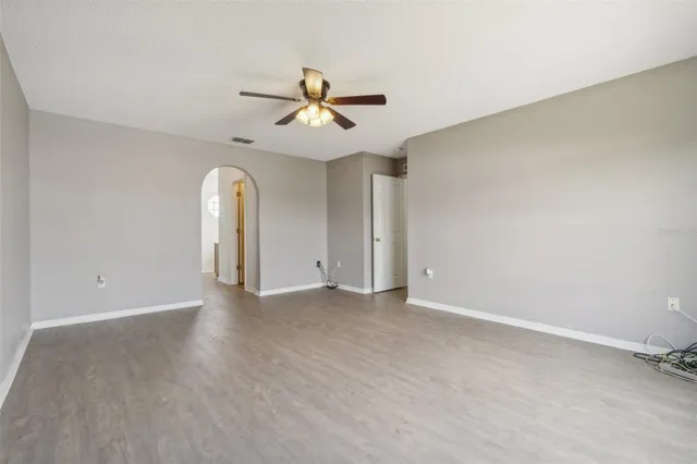 a view of an empty room with a window