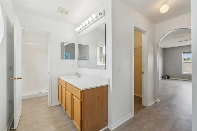 a bathroom with a sink a mirror and a toilet
