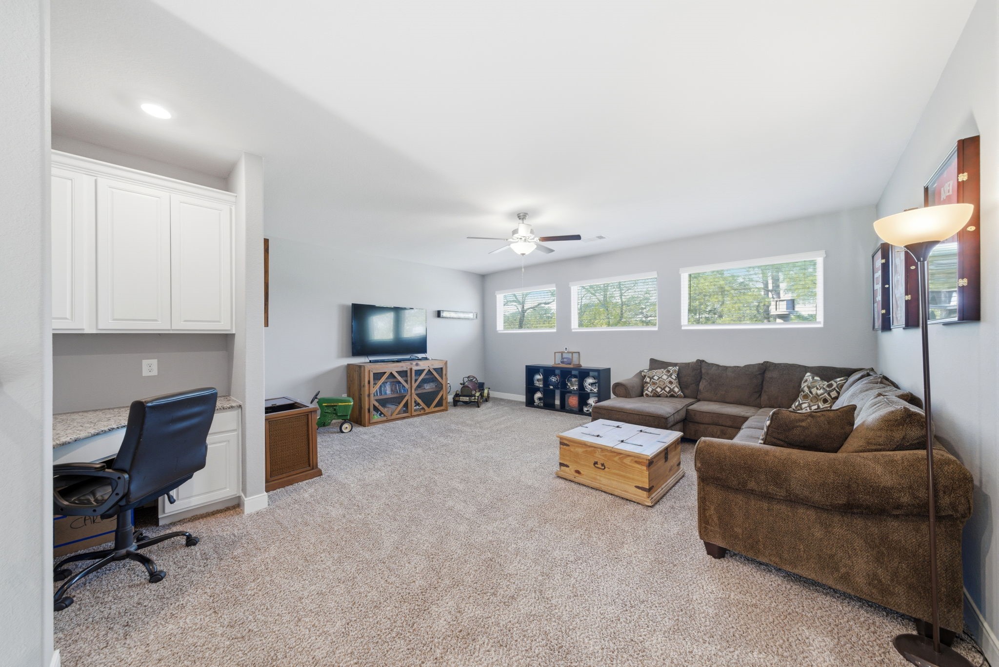 129 Magnolia Reserve Loop Magnolia, TX 77354 - Photo 20 of 34 Up the stairs is the second floor game room with built-in desk nook.