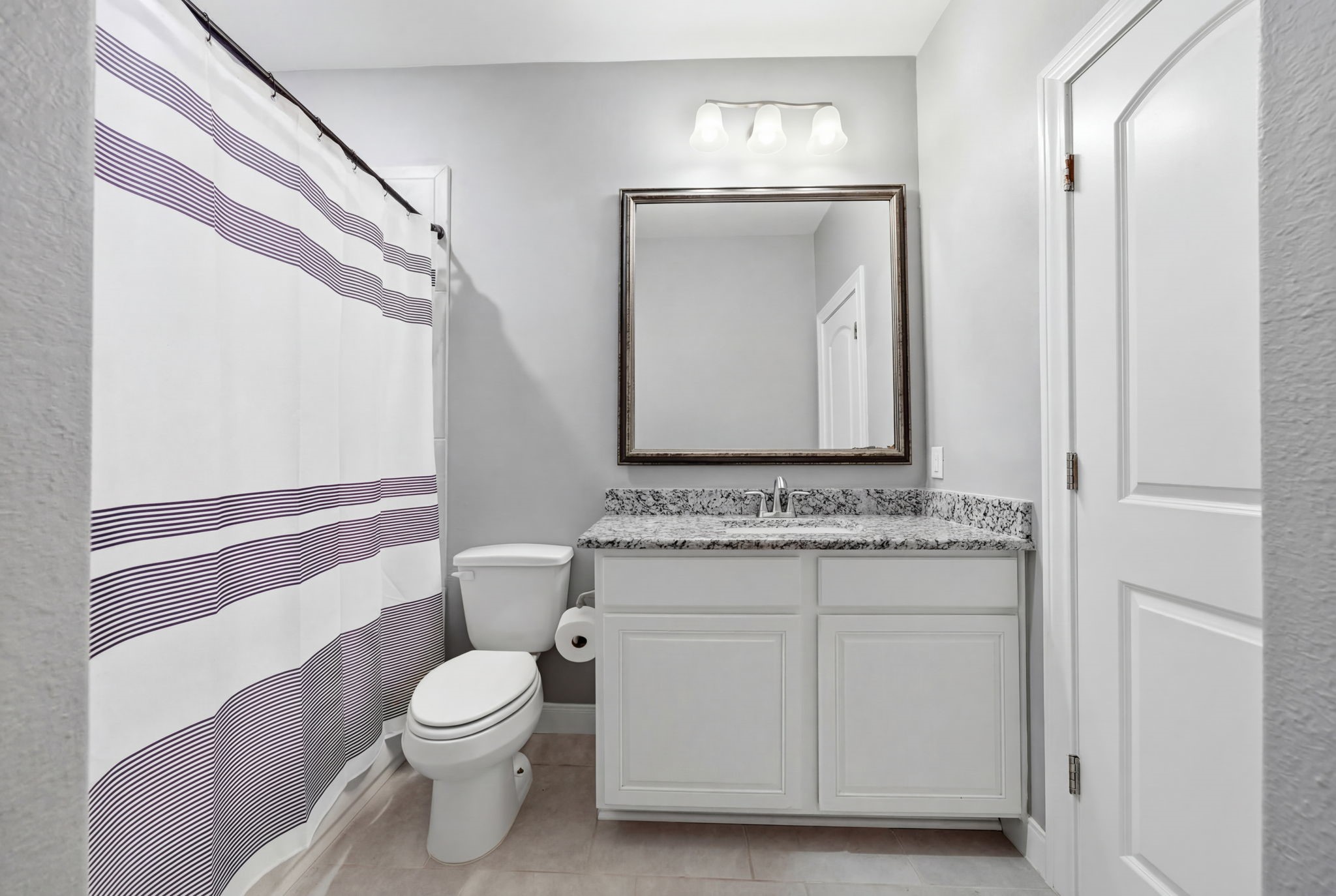 129 Magnolia Reserve Loop Magnolia, TX 77354 - Photo 24 of 34 The hall bath is conveniently located between Bedrooms #3 and #4.