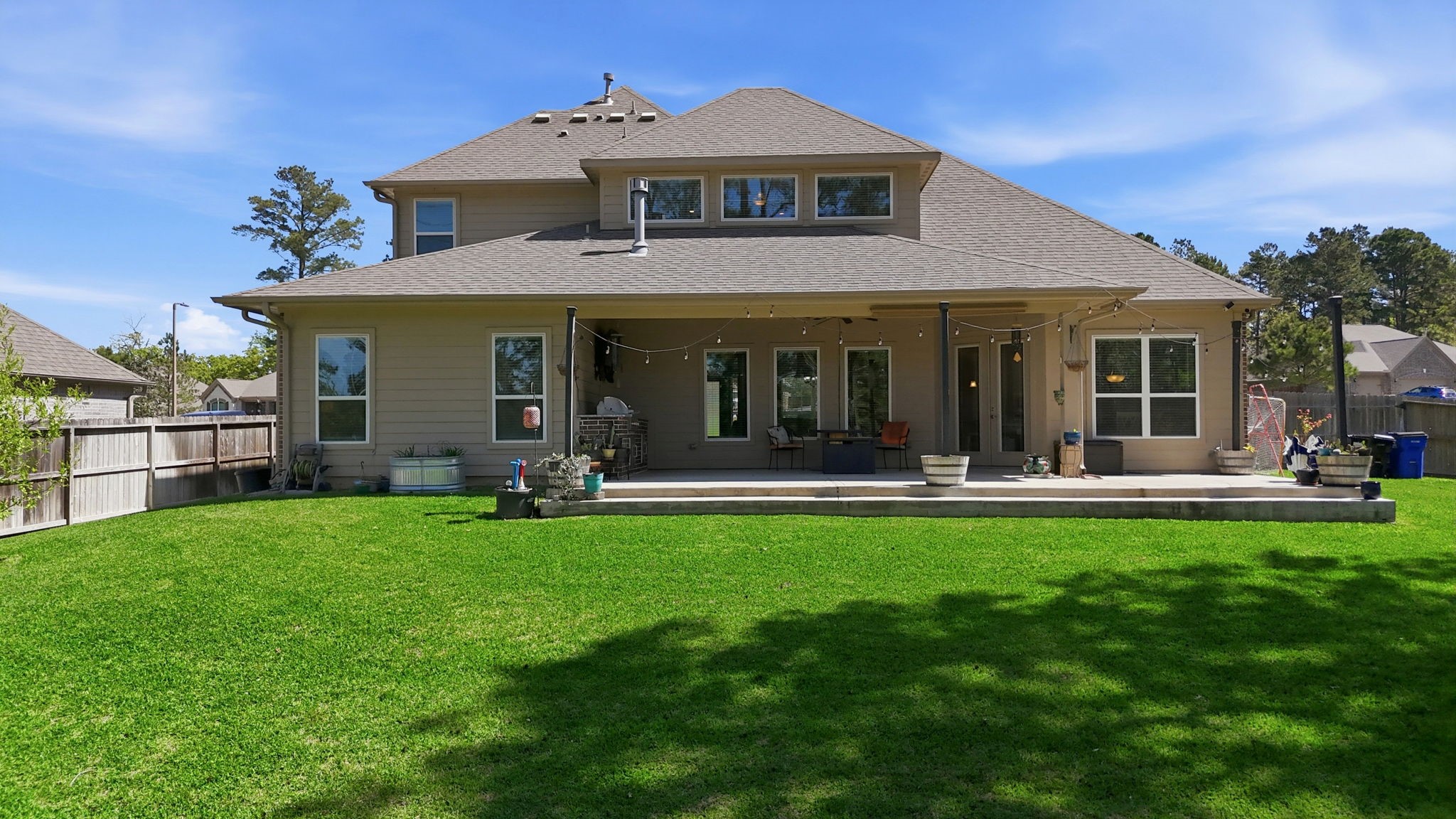 129 Magnolia Reserve Loop Magnolia, TX 77354 - Photo 27 of 34 The rear view of the home really showcases the massive patio.