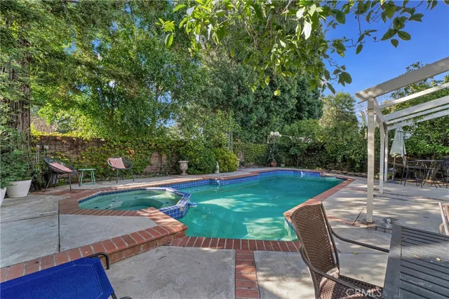 a view of a backyard with sitting area