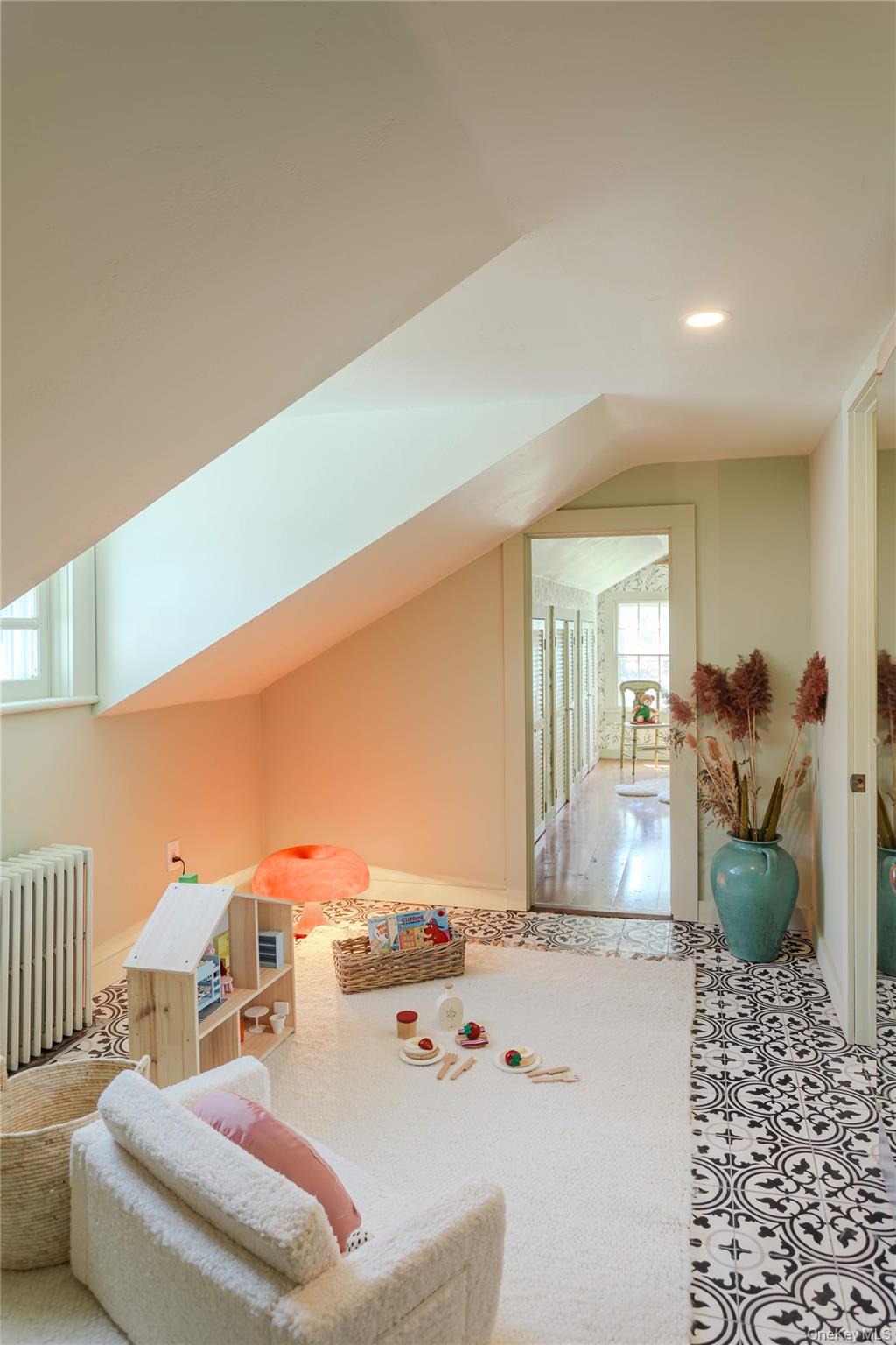 210 Middle Road Hudson, NY 12534 - Photo 39 of 42 Loft space with sloped ceilings, decorative floor tile, patterned accents, and a skylight.