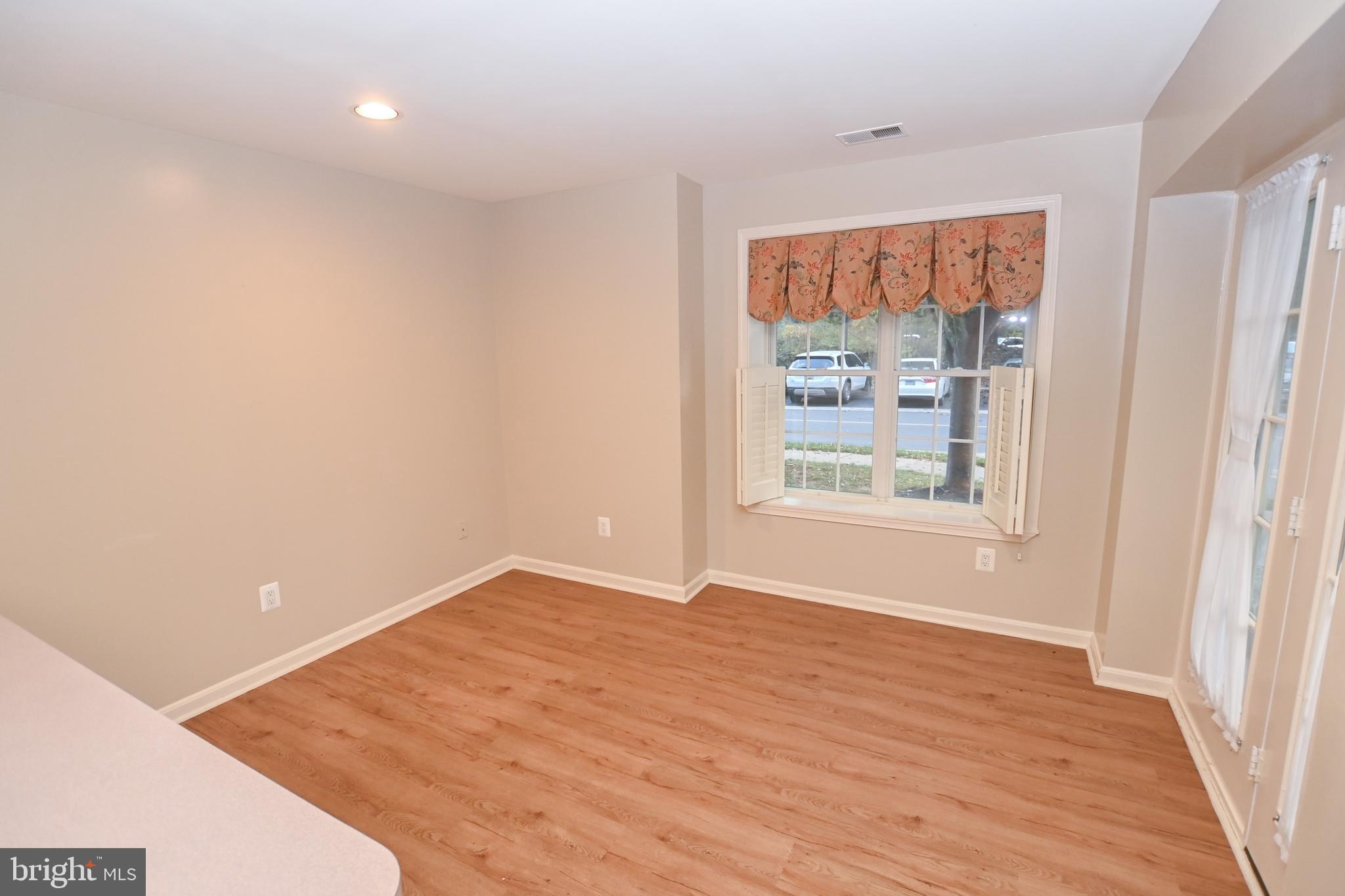 12330 Rosslare Ridge Road, Unit 108 Lutherville-Timonium, MD 21093 - Photo 14 of 28 Breakfast area off kitchen kitchen w/new flooring