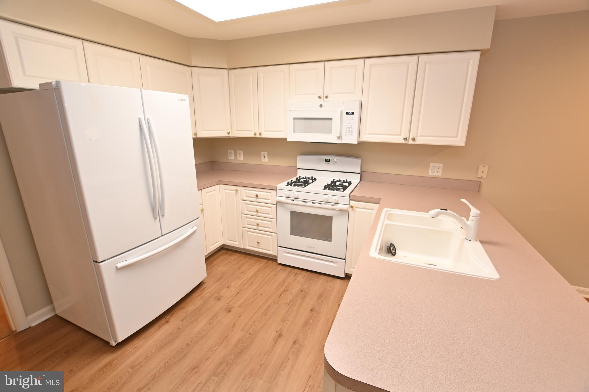 12330 Rosslare Ridge Road, Unit 108 Lutherville-Timonium, MD 21093 - Photo 9 of 23 All white bright kitchen