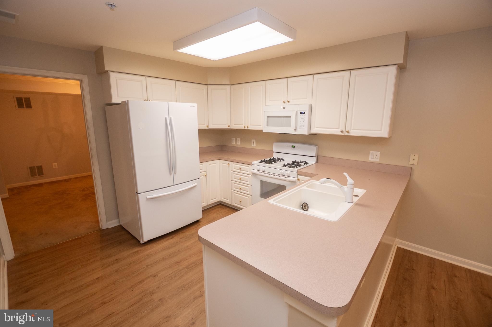 12330 Rosslare Ridge Road, Unit 108 Lutherville-Timonium, MD 21093 - Photo 9 of 28 View of kitchen from dining room