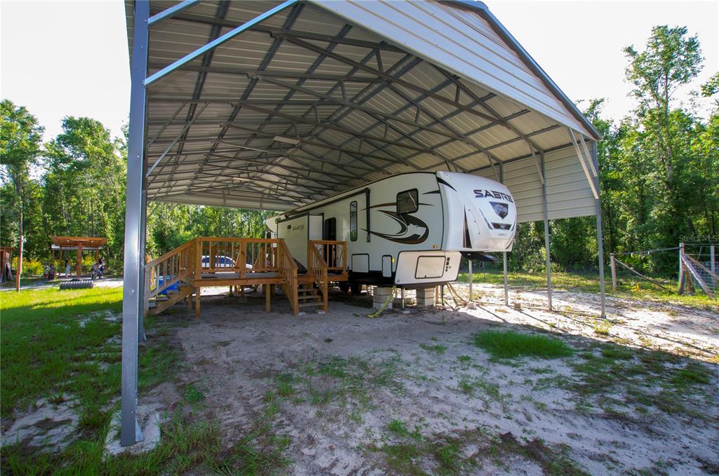 18233 185th Road Live Oak, FL 32060 - Photo 13 of 99 a view of a car park in front of a house