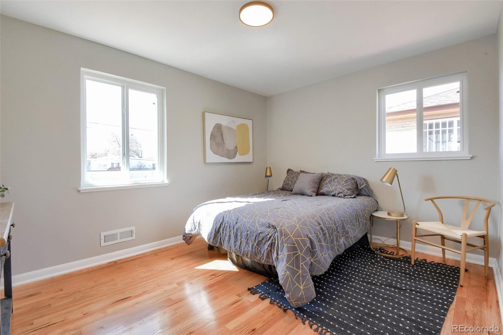 3014 Magnolia Street Denver, CO 80207 - Photo 11 of 16 a bed room with a bed and a window