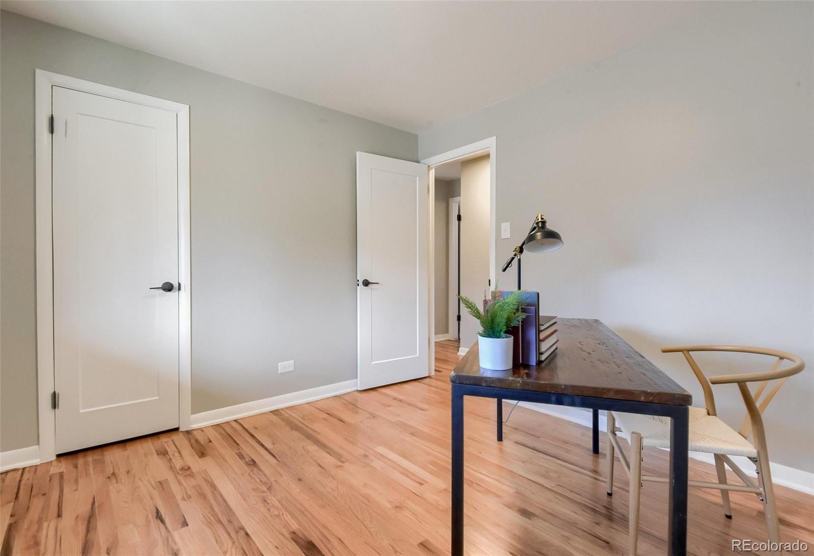 3014 Magnolia Street Denver, CO 80207 - Photo 13 of 16 a view of a livingroom with wooden floor and furniture