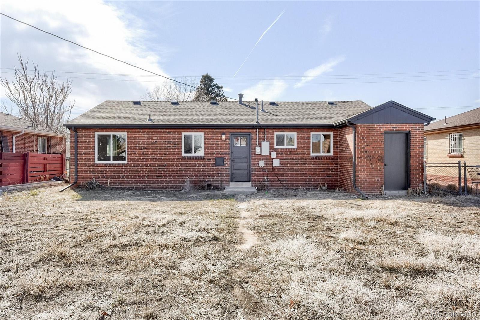 3014 Magnolia Street Denver, CO 80207 - Photo 16 of 16 a view of a house with a yard