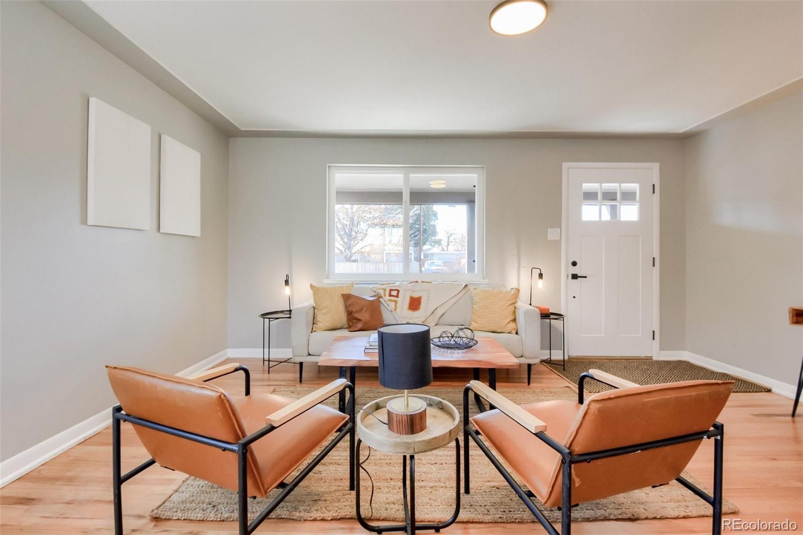 3014 Magnolia Street Denver, CO 80207 - Photo 3 of 16 a living room with furniture and a window