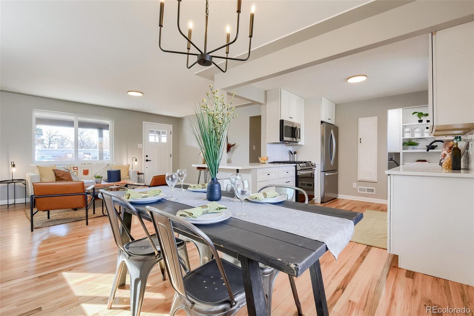 3014 Magnolia Street Denver, CO 80207 - Photo 10 of 16 a view of a dining room with furniture window and wooden floor
