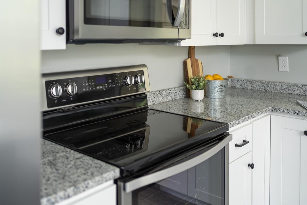 3124 Lyndhurst Road Stuarts Draft, VA 24477 - Photo 14 of 37 a kitchen with stainless steel appliances granite countertop a stove and a microwave
