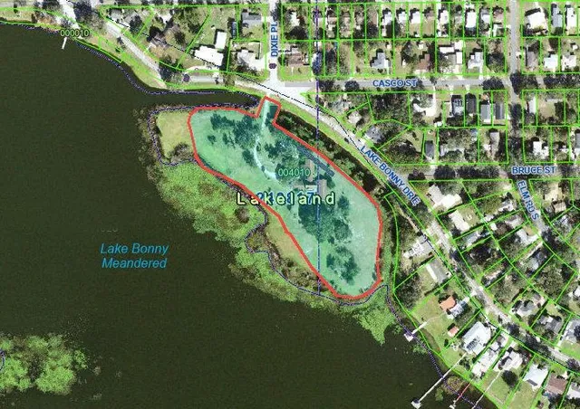 a view of a swimming pool with a patio and a yard