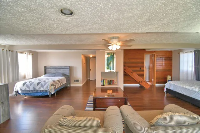 a bathroom with a granite countertop toilet sink and shower