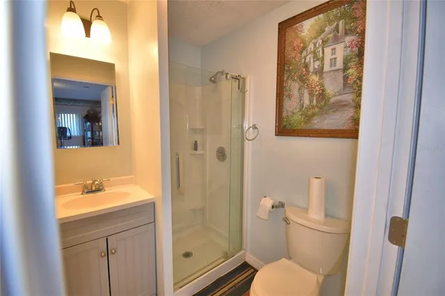 a view of a living room and kitchen with furniture