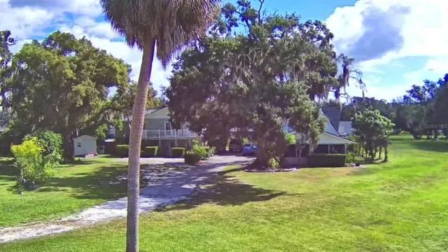 a view of a house with a big yard