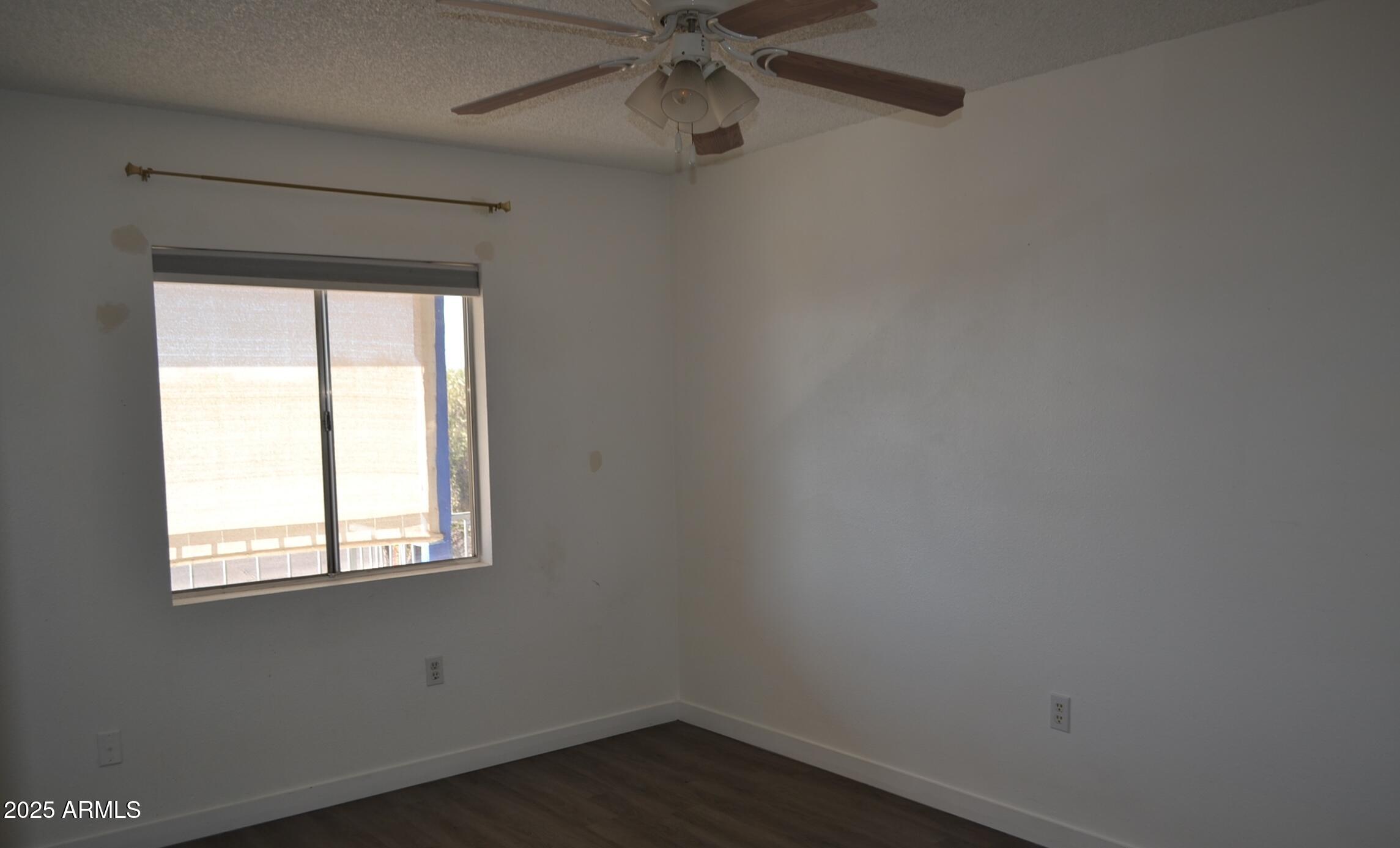 111 South Outpost Road, Unit 3 Apache Junction, AZ 85119 - Photo 1 of 7 an empty room with a window