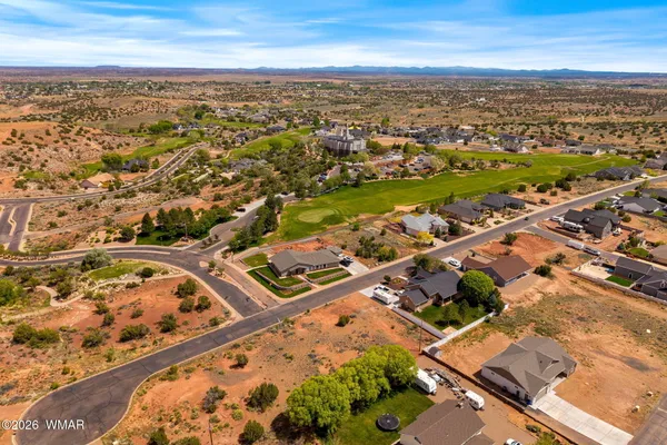 an aerial view of residential building with parking space