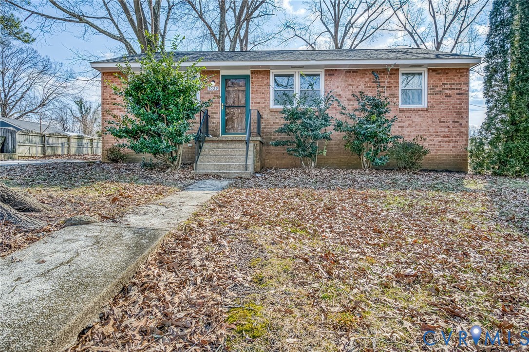 front view of a house with a tree