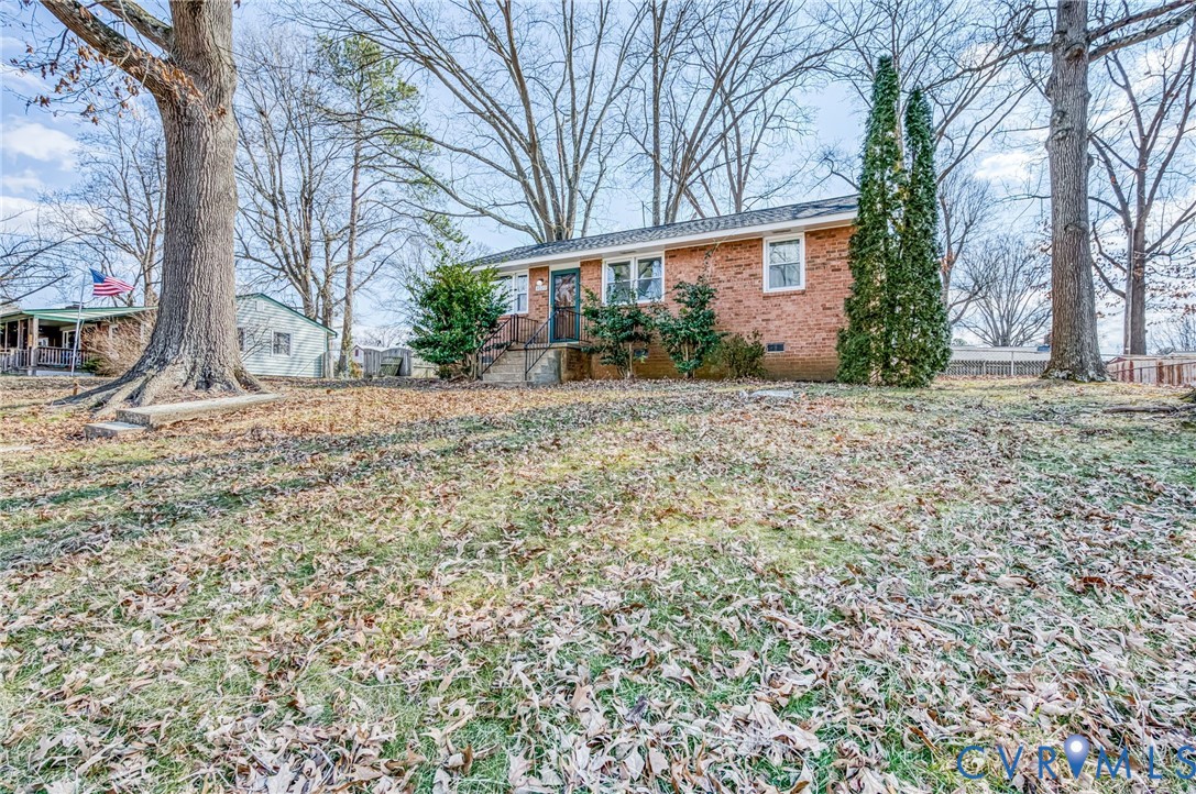 3029 Gaffney Road Richmond, VA 23237 - Photo 2 of 21 a view of a house with a yard and garage