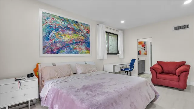 a bedroom with a bed and furniture