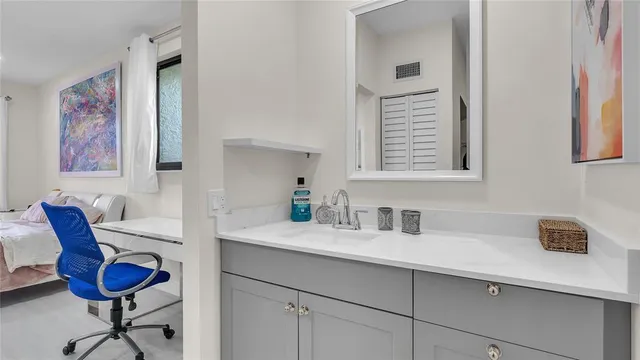 a bathroom with a sink and a mirror