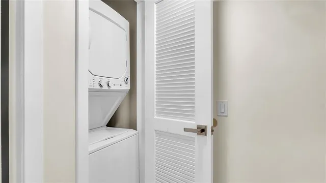 a view of a big yard with a fountain and a plants