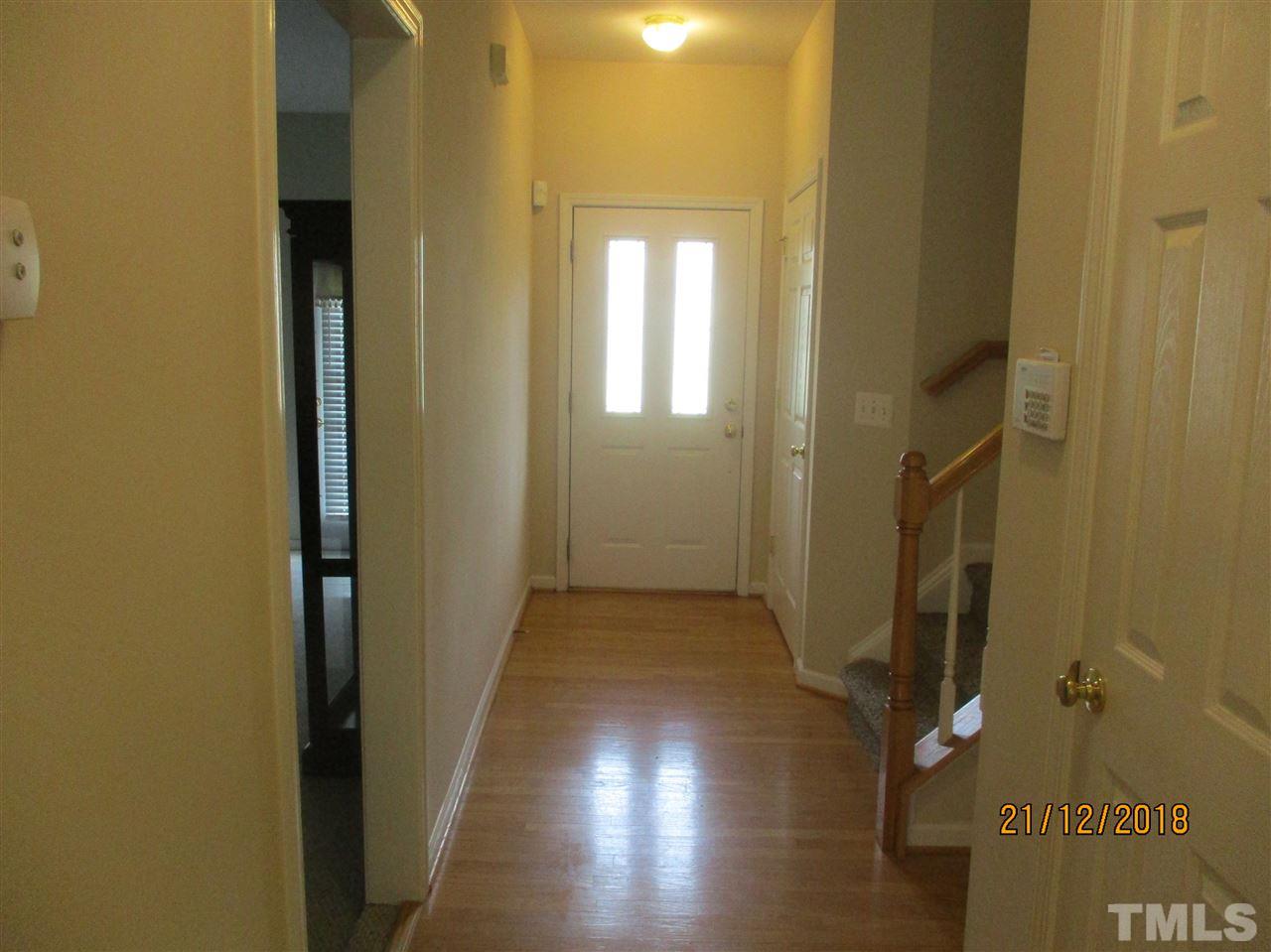2822 Andover Glen Road Raleigh, NC 27604 - Photo 7 of 18 Foyer with hardwood floors. Door to left goes into bonus room (enclosed garage)