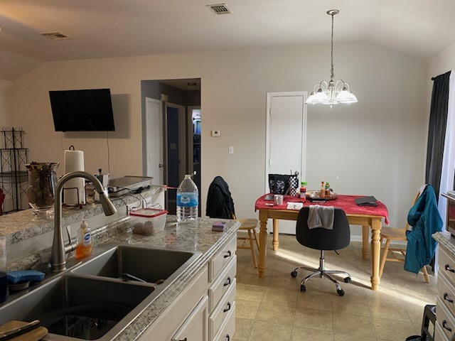 2303 North 12th Street Temple, TX 76501 - Photo 7 of 10 a kitchen with a sink stove and microwave