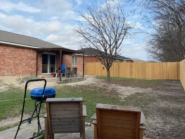 a backyard of a house with seating space