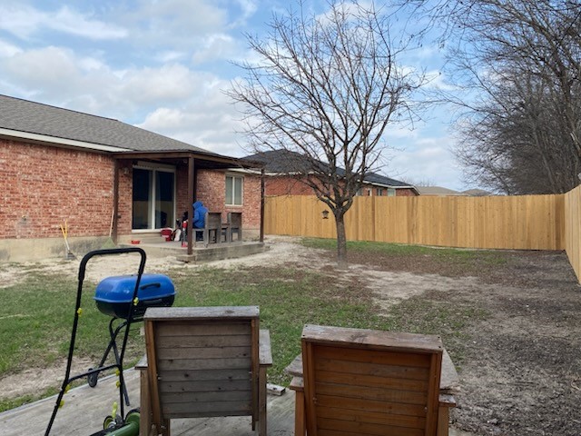 2303 North 12th Street Temple, TX 76501 - Photo 9 of 10 a backyard of a house with seating space