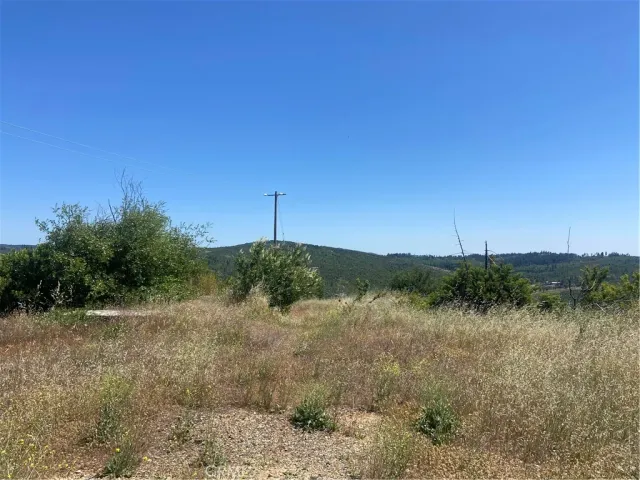 a view of a lake next to a yard
