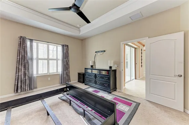 a bedroom with furniture and a window