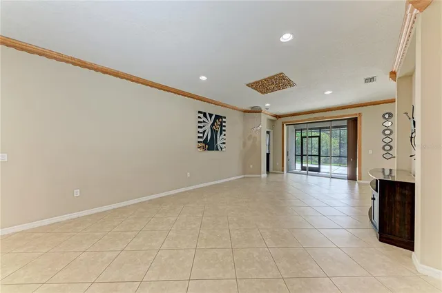 a view of an empty room with glass door
