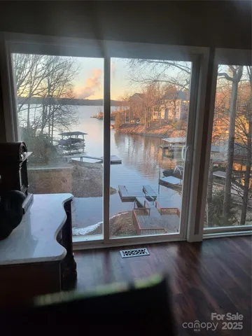 a room with wooden floor and a window