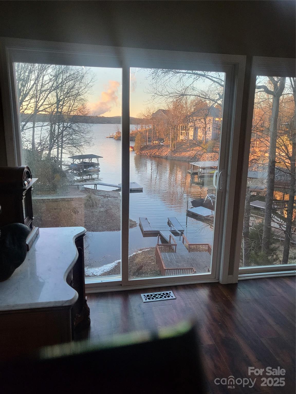 29034 Snapper Point Tega Cay, SC 29708 - Photo 5 of 6 a room with wooden floor and a window