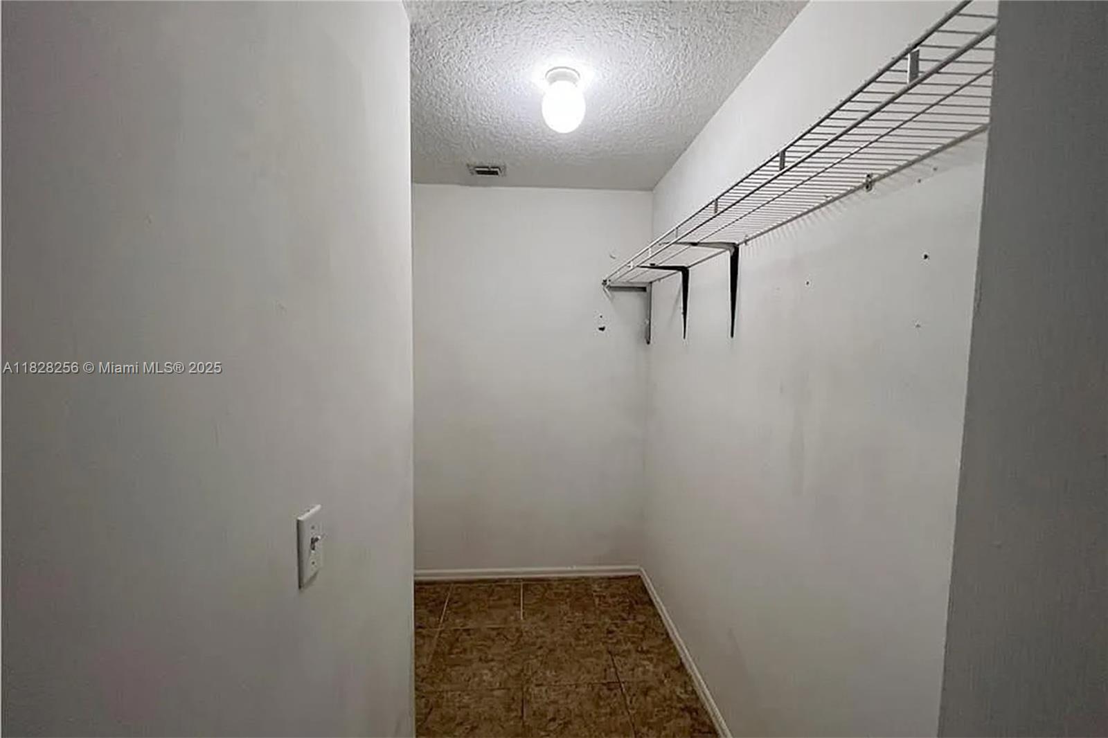 13990 Southwest 260th Street, Unit 101 Homestead, FL 33032 - Photo 14 of 34 a view of a hallway