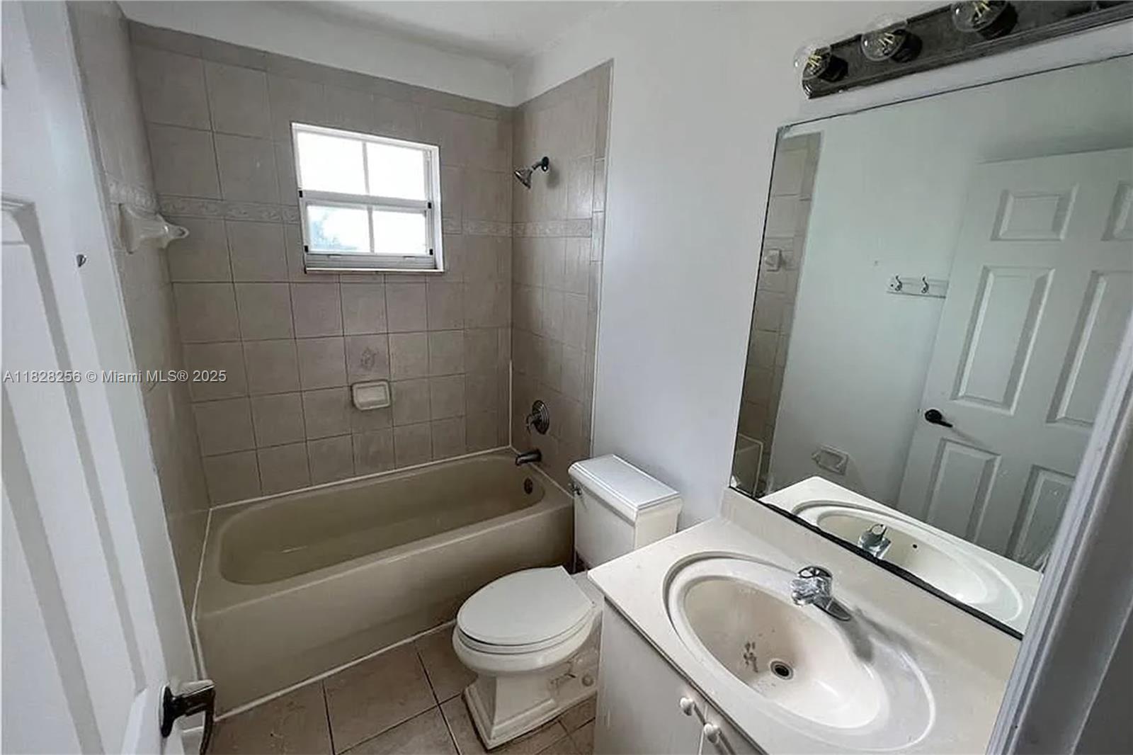13990 Southwest 260th Street, Unit 101 Homestead, FL 33032 - Photo 16 of 34 a bathroom with a sink and a toilet